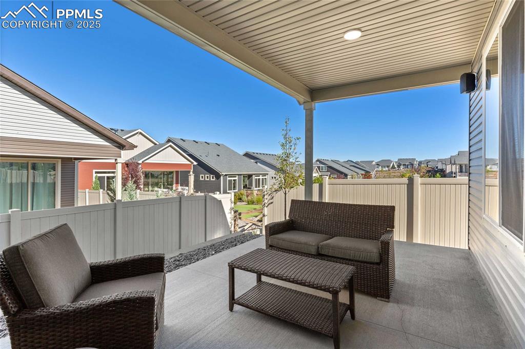 Image 18 of 27: View of patio with a residential view and an outdoor hangout area