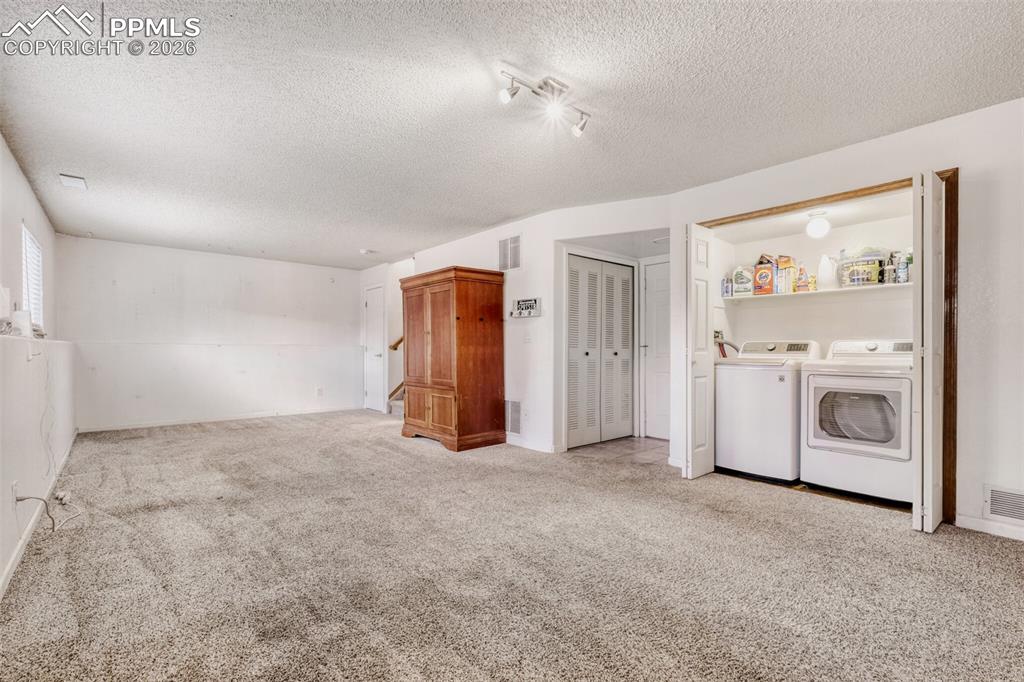 Image 13 of 17: Lower Level Laundry - Washer & Dryer Stay