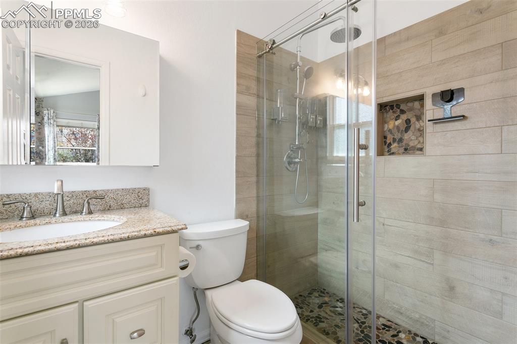Image 24 of 36: Huge shower with custom tile finishes