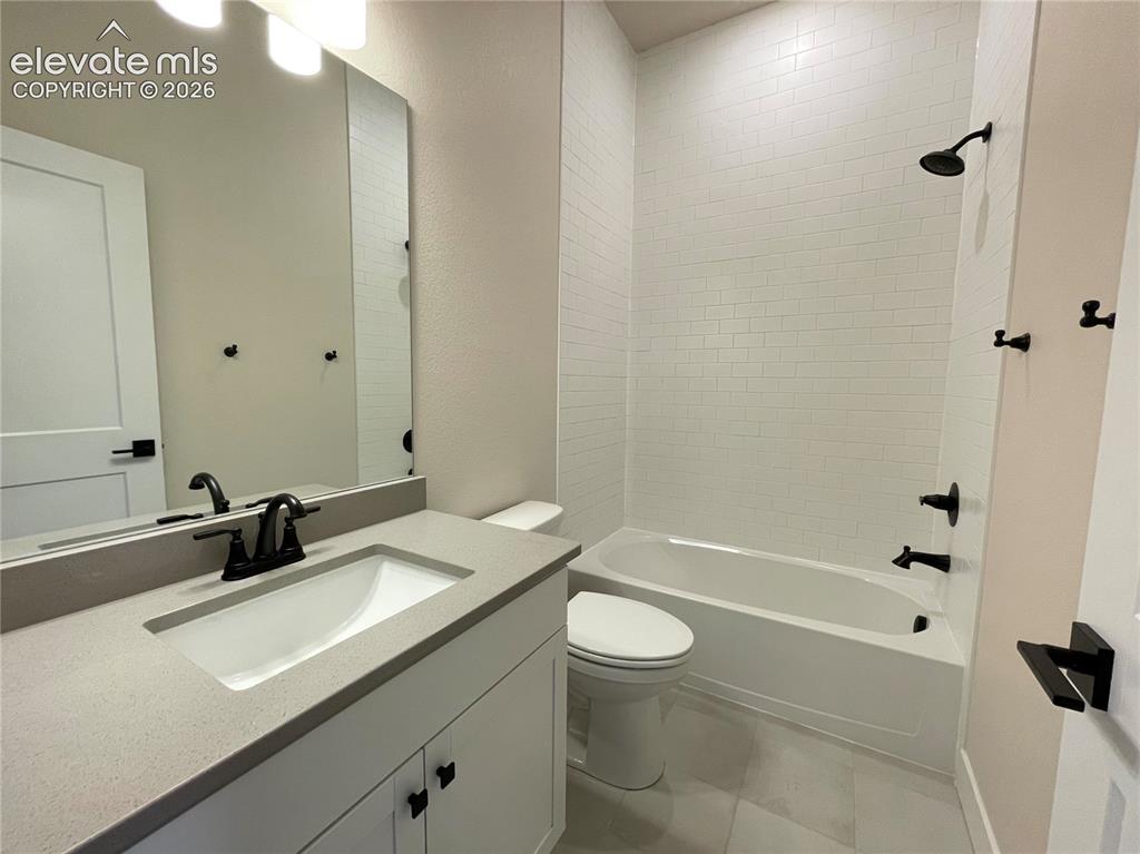 Image 8 of 13: Main level hall bath