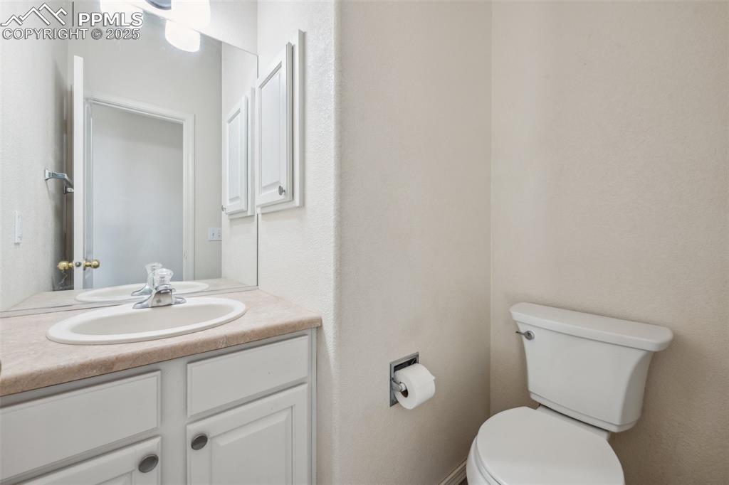 Image 21 of 38: Bathroom with vanity and toilet