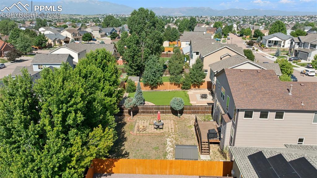Image 7 of 38: Aerial view of residential area featuring mountains