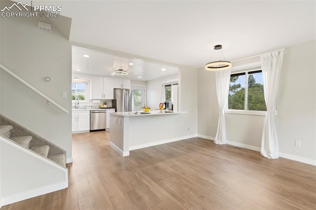 Image 12 of 50: A large dining area adjoins the kitchen and great room.