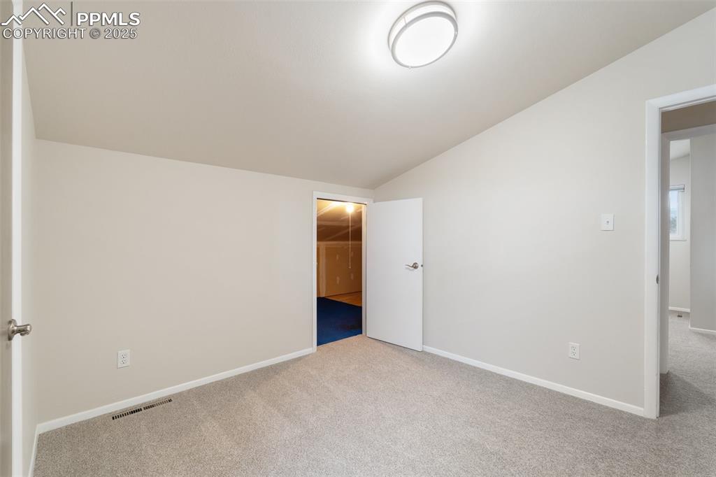 Image 26 of 50: Bedroom 4 features access to the 238 sq. ft. attic room!