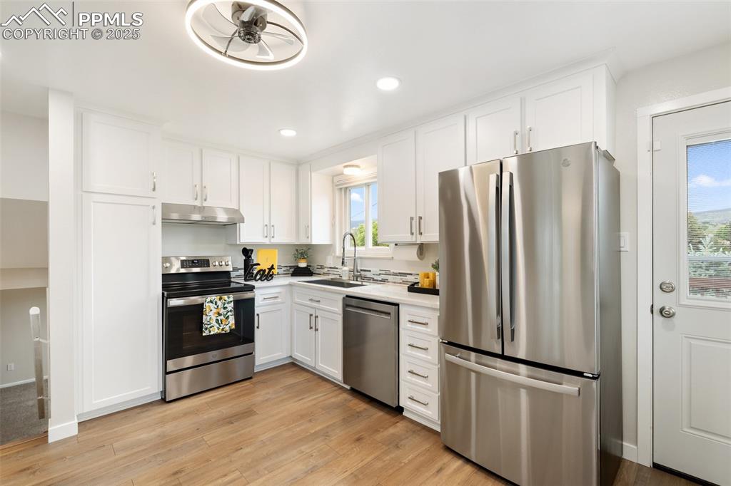 Image 7 of 50: New lighting, counter-depth refrigerator, VIEWS!