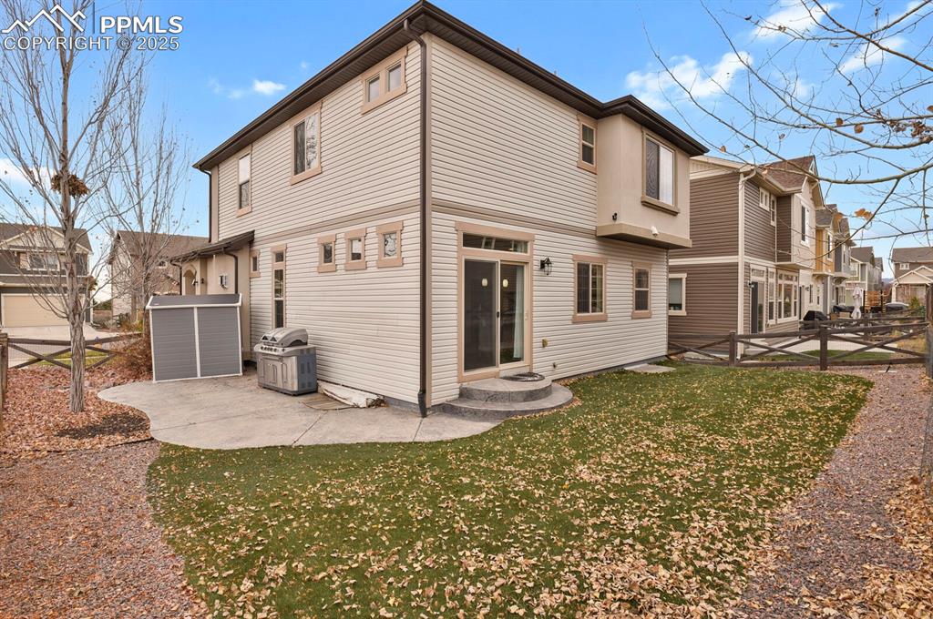 Image 26 of 30: Rear view of house featuring a patio and a residential view
