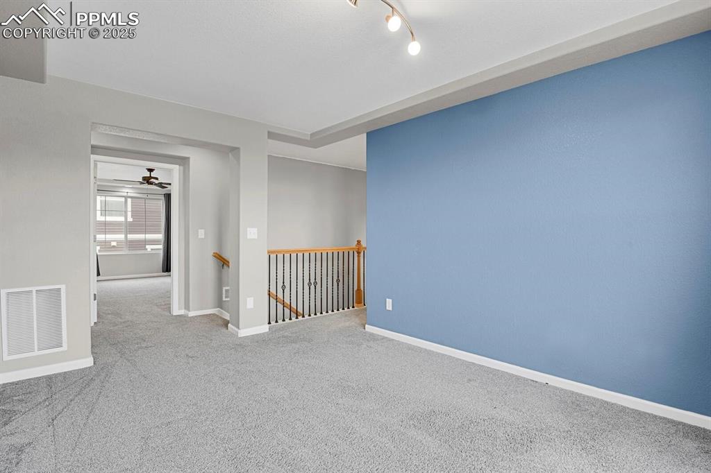 Image 29 of 30: Carpeted empty room featuring baseboards