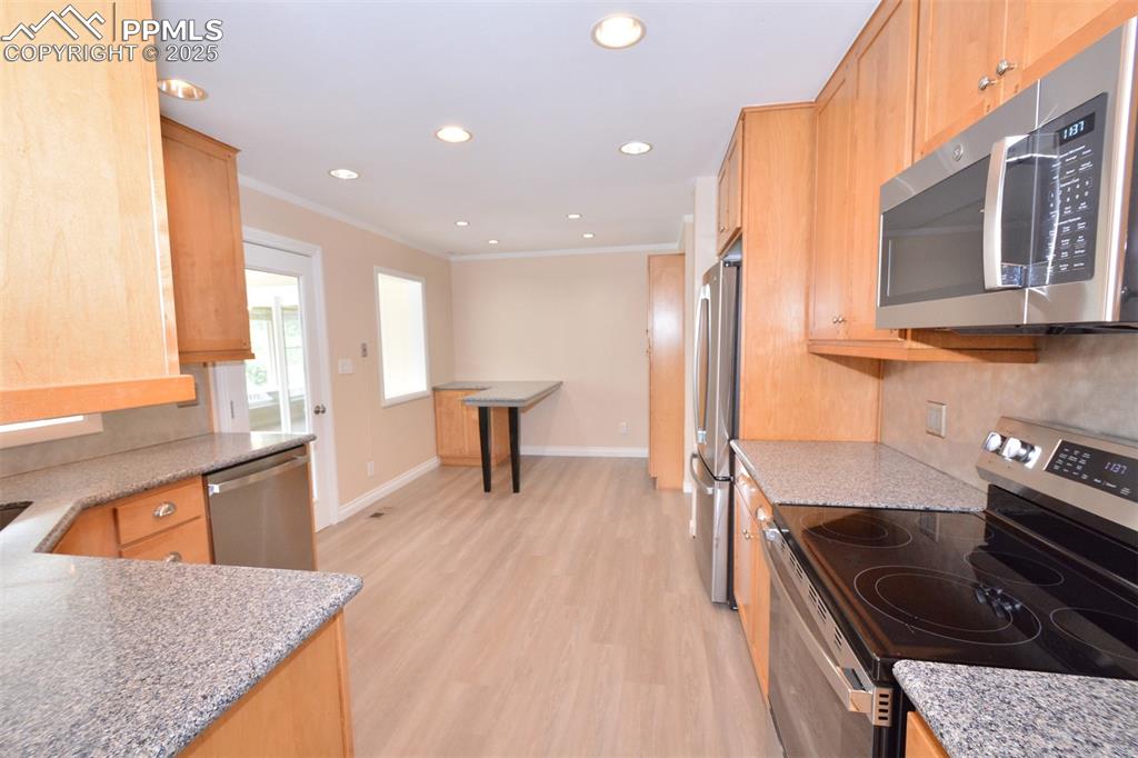 Image 10 of 50: Kitchen with new stainless appliances, granite counter tops and eat-in brea