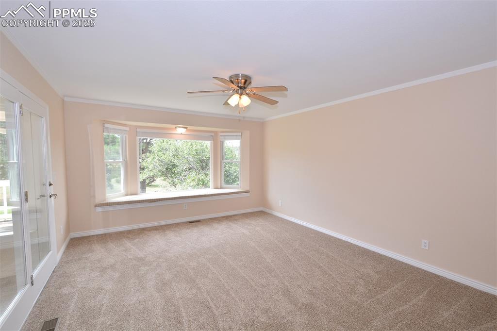 Image 15 of 50: Master Bedroom with ceiling fan