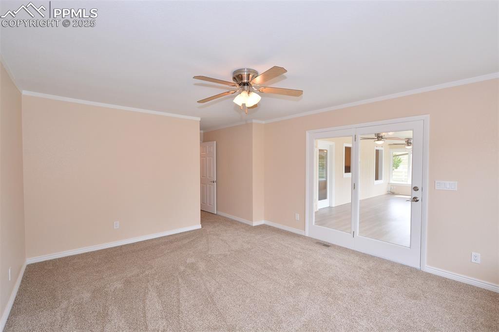 Image 17 of 50: Master Bedroom has an access door into the sunroom