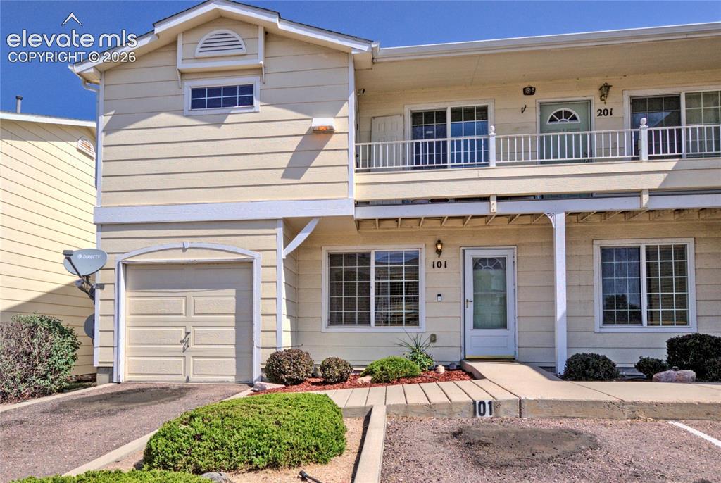 Image 1 of 28: Two-story exterior with horizontal siding and multiple windows