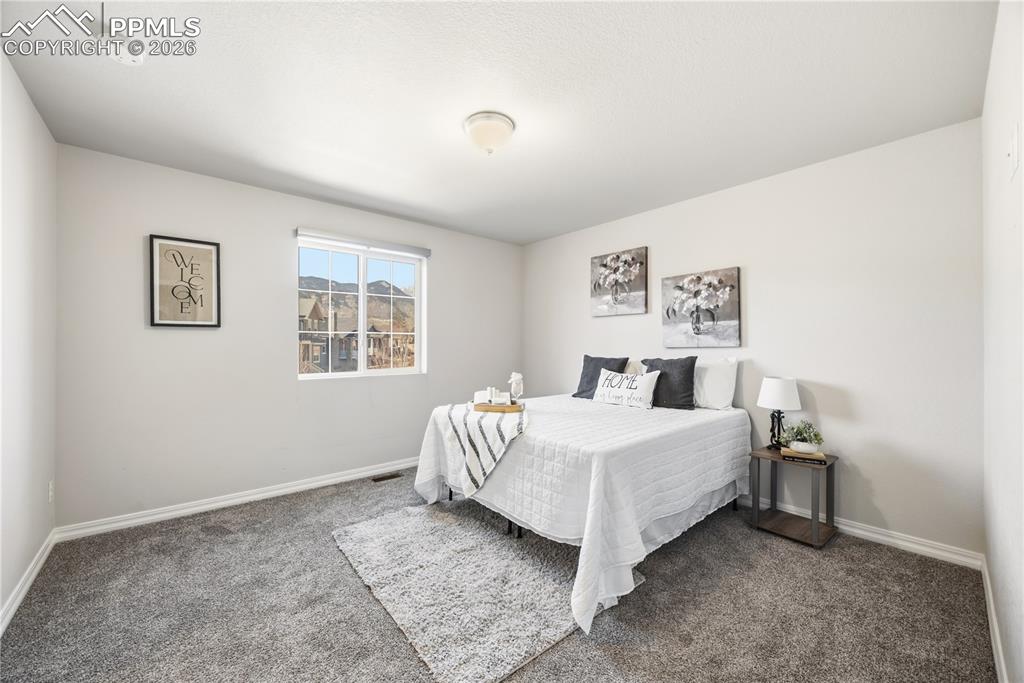 Image 19 of 38: Bedroom