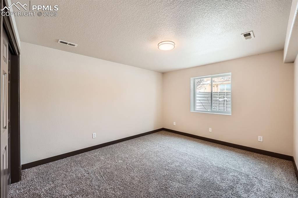 Image 17 of 25: Basement Bedroom