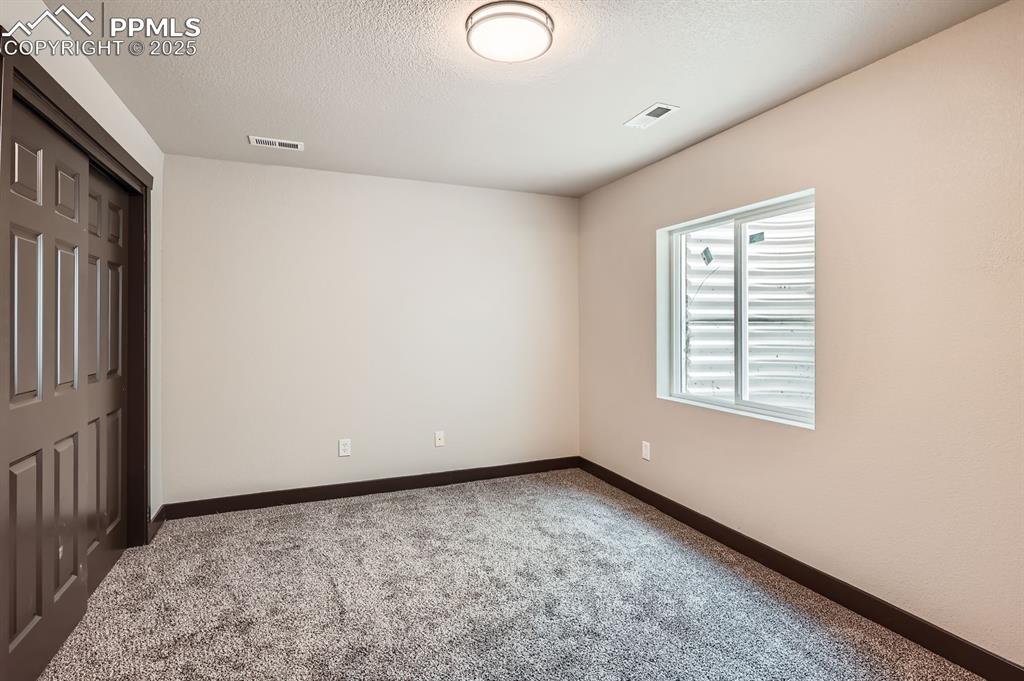 Image 19 of 25: Basement Bedroom