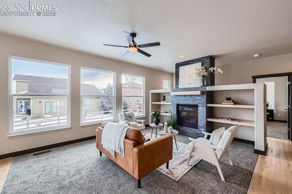 Image 3 of 25: Living Room Feature a Gas Fireplace
