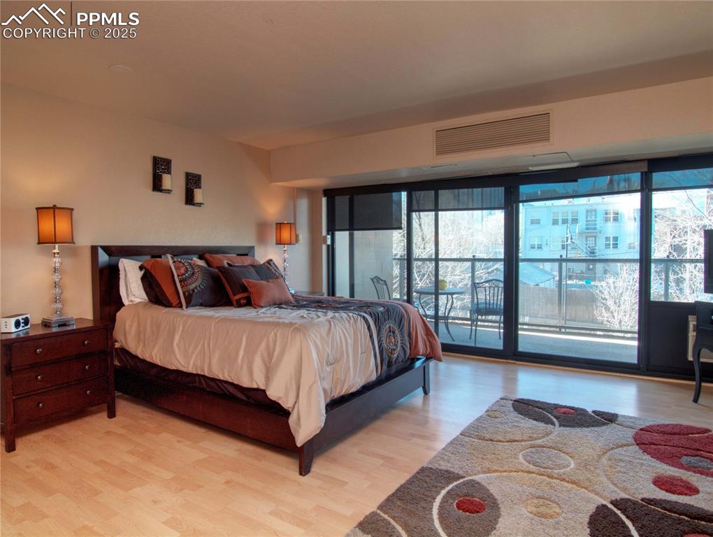 Image 9 of 15: main bedroom with adjoining full bath and walk out balcony.