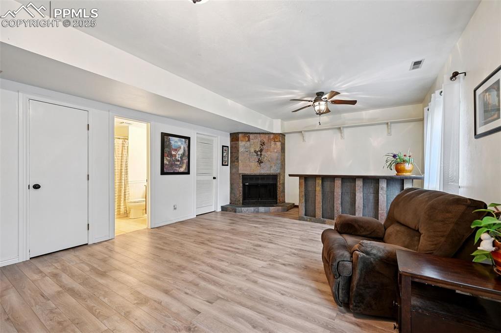 Image 12 of 42: Enjoy this space with fireplace and bar.