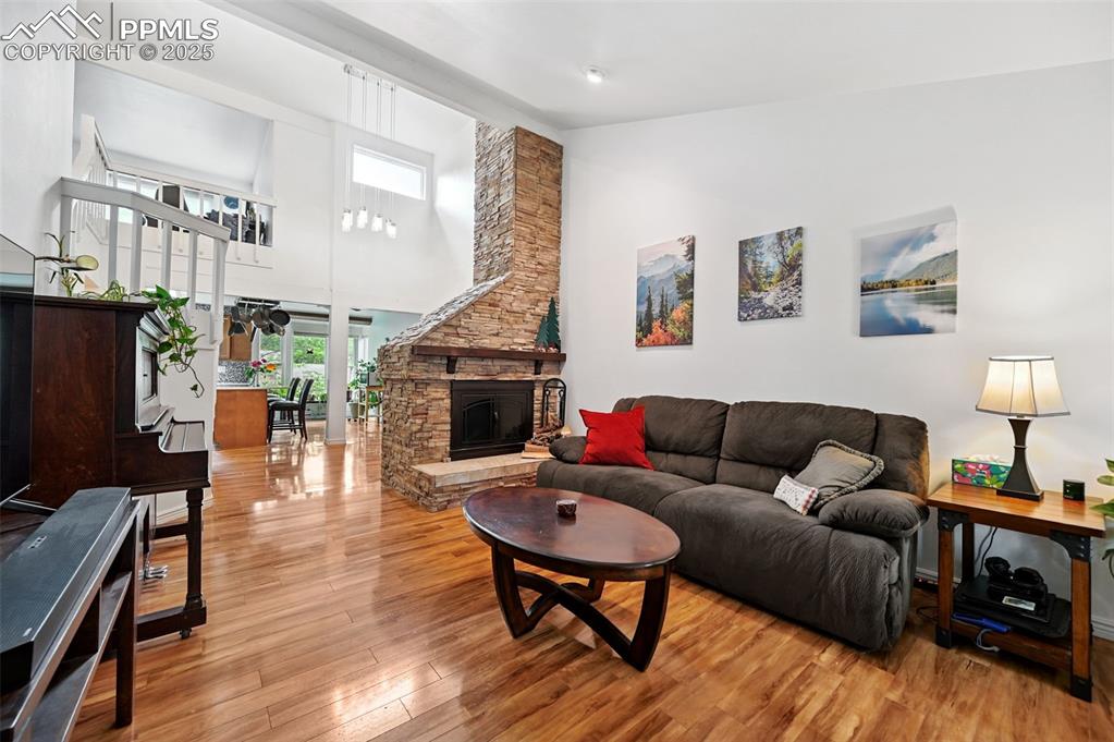 Image 2 of 42: Living room with high vaulted ceiling with a very open feel.