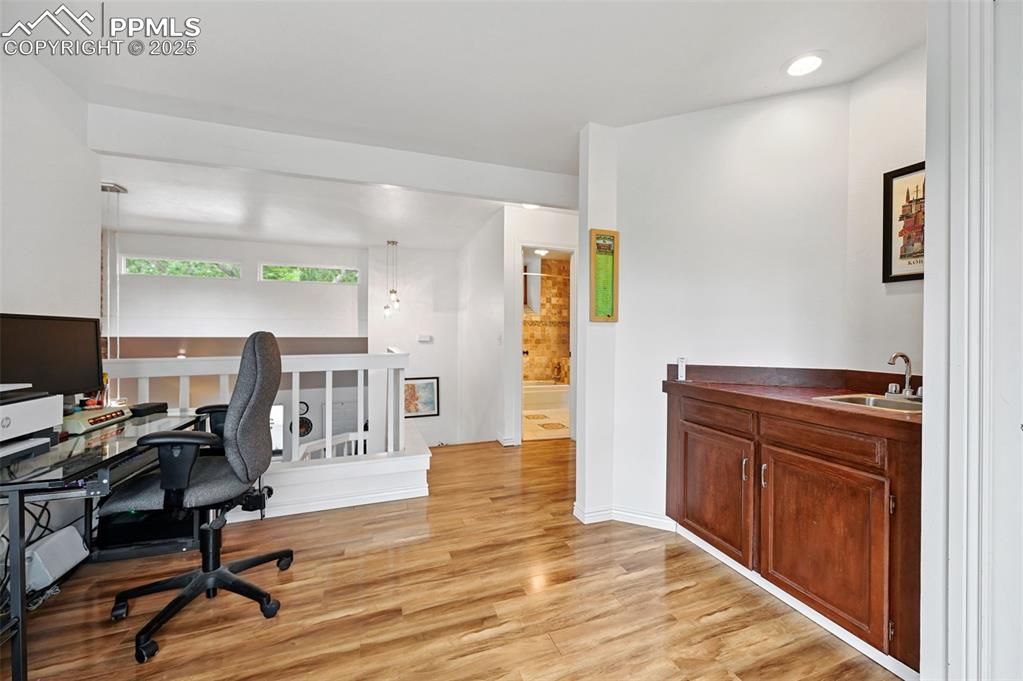 Image 22 of 42: The loft also includes a wet bar and closet!