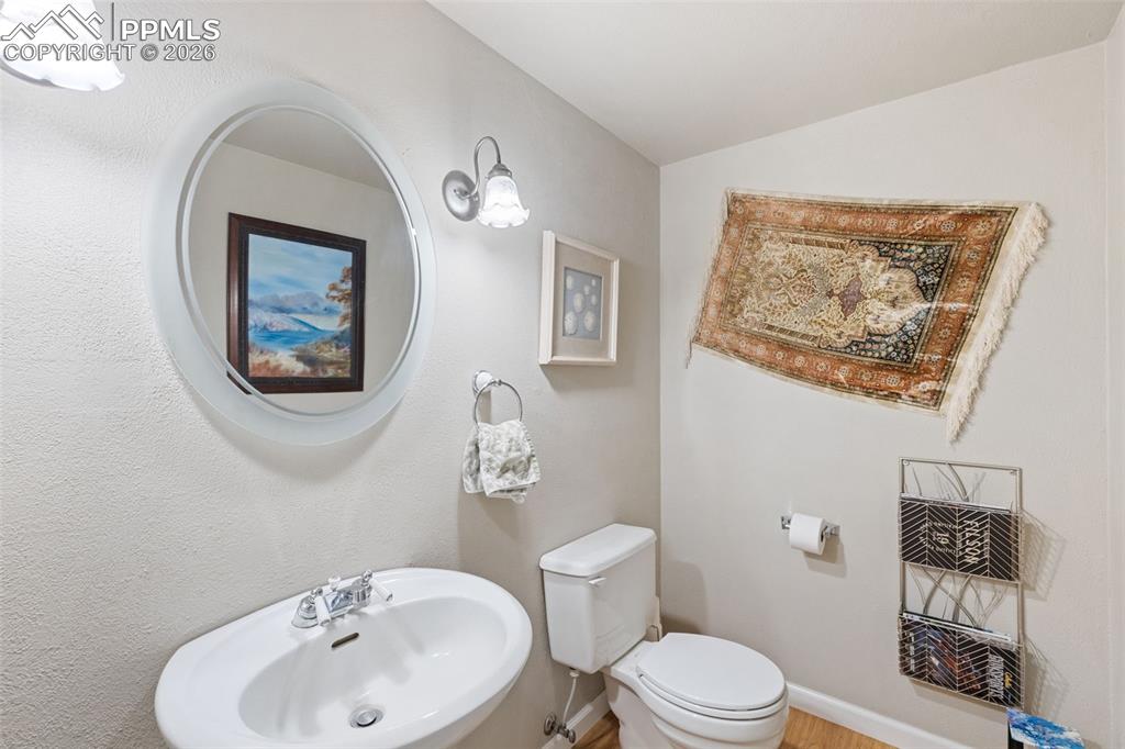 Image 12 of 34: Main level half bathroom