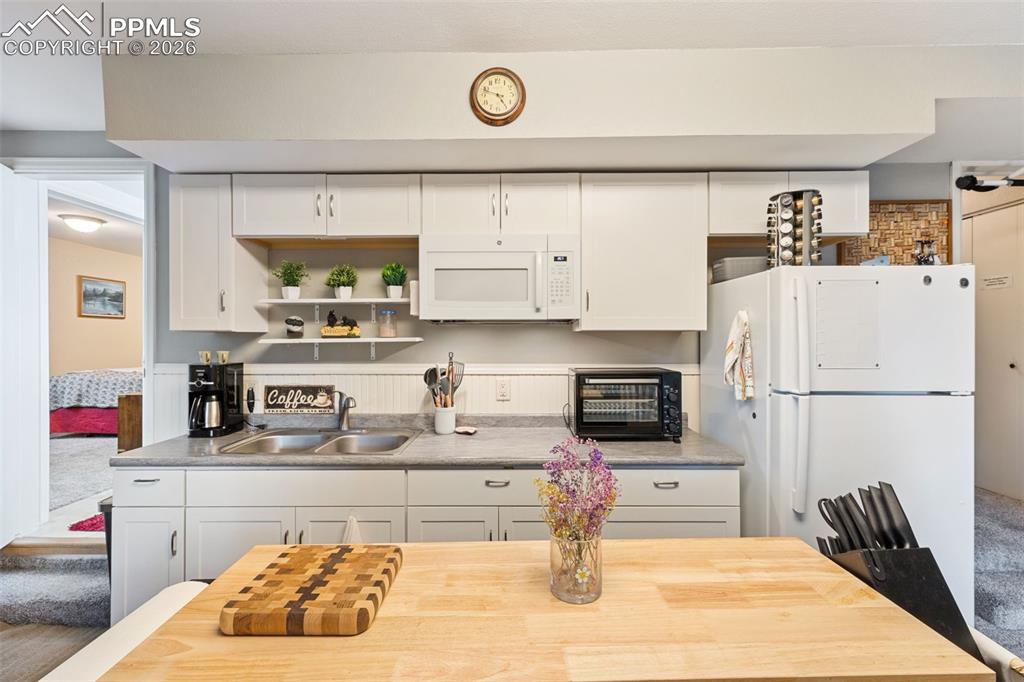 Image 22 of 34: Basement apartment kitchenette