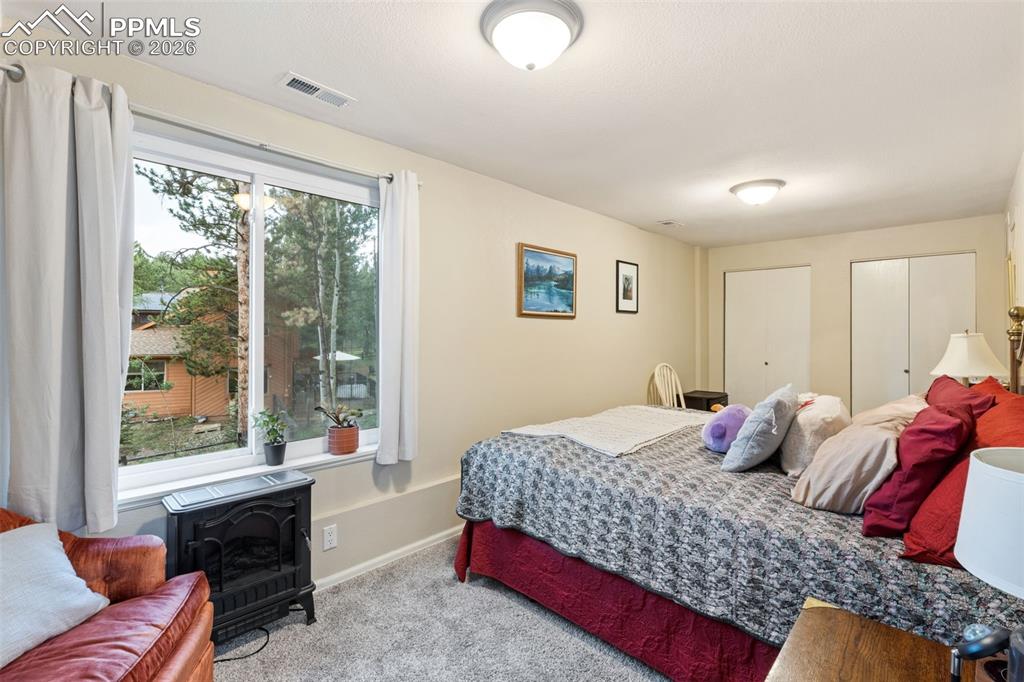 Image 26 of 34: Basement apartment bedroom