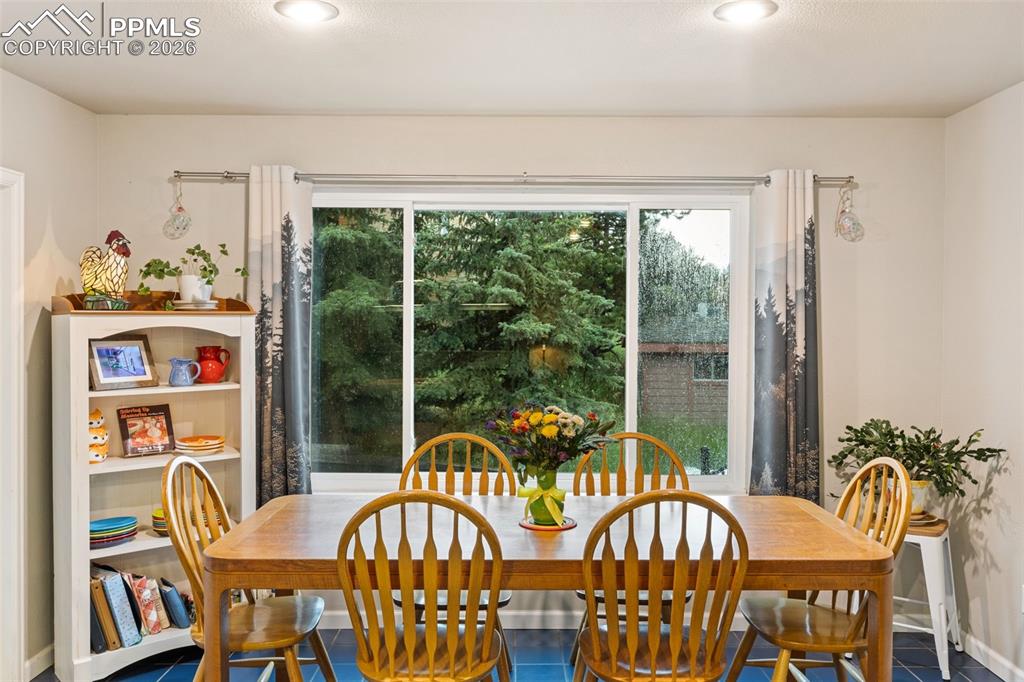 Image 5 of 34: Eat-in kitchen/dining area (photo taken during rainstorm)