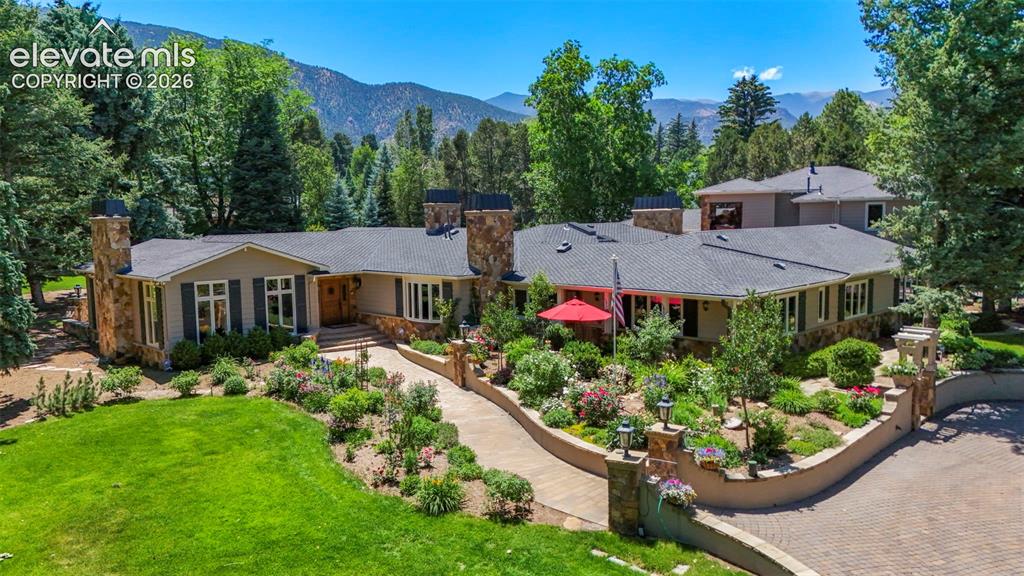 Image 1 of 50: 1.31 acres of gardens and gorgeous landscaping.