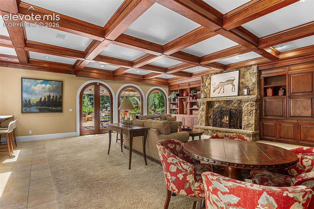 Image 14 of 50: Gorgeous woodwork in living area off of kitchen.