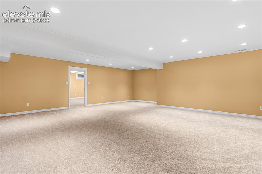 Image 39 of 50: Huge basement is great for pool table/ ping pong/ bar/ media.
