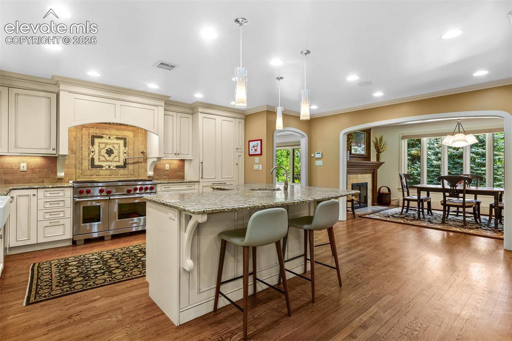 Image 8 of 50: Expansive kitchen opens to informal dining area.