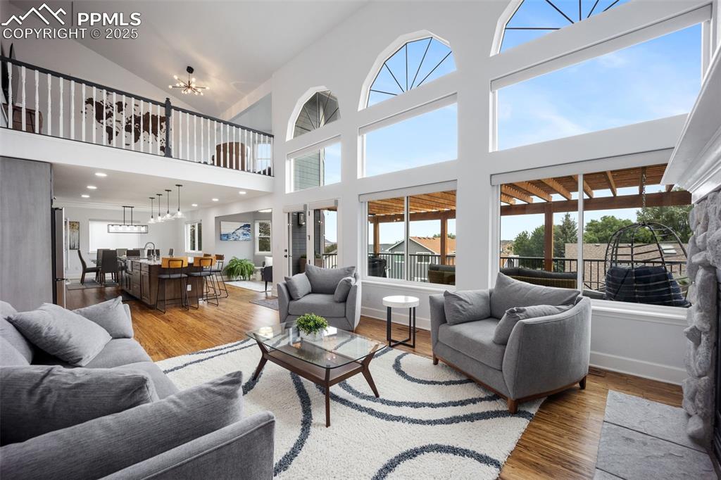 Image 11 of 44: Living area featuring light wood-style floors, plenty of natural light, and