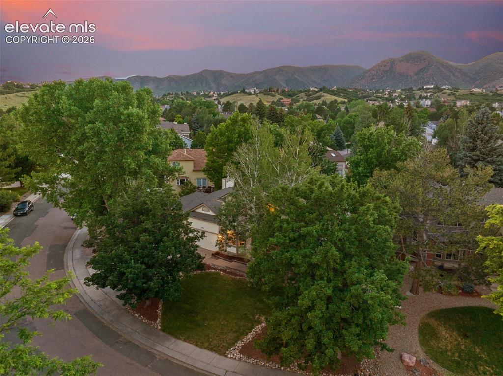 Image 47 of 49: Aerial perspective showcasing a residential cul-de-sac with mature trees an