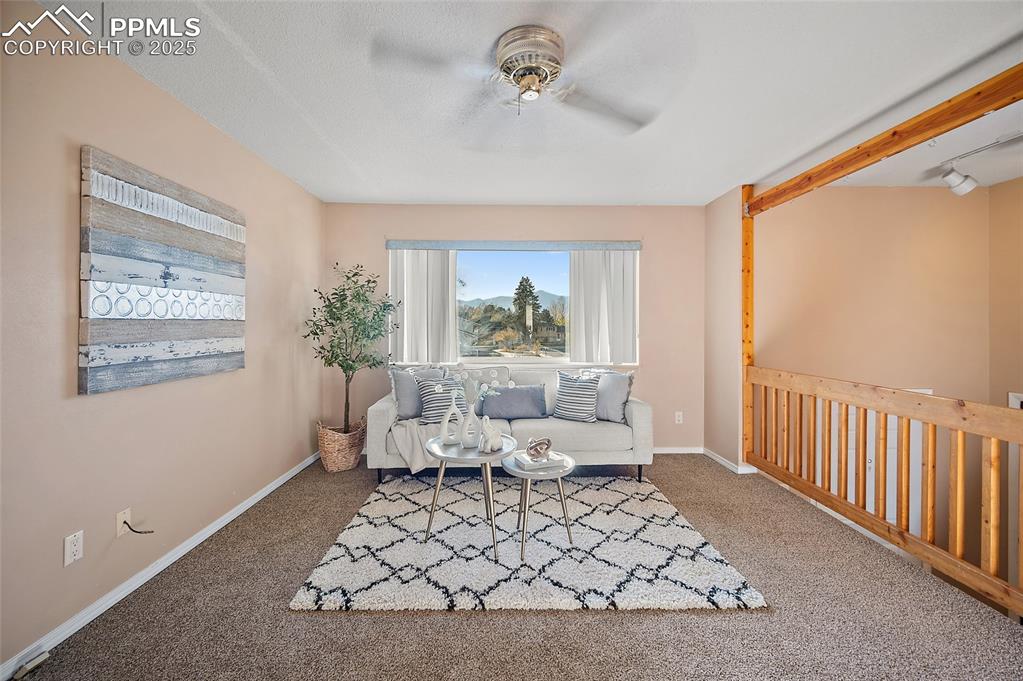 Image 6 of 49: upstairs with views of Pikes Peak