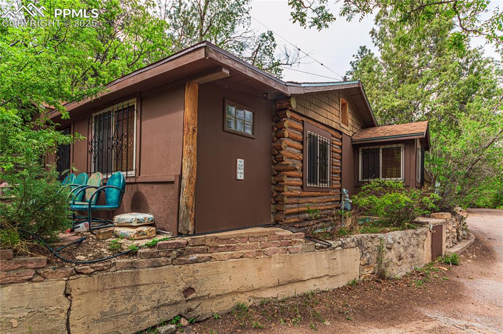 Image 13 of 23: View of property exterior with log exterior