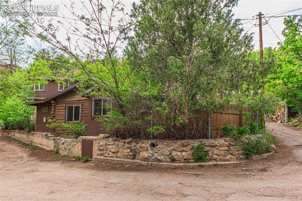 Image 14 of 23: View of property exterior featuring log exterior
