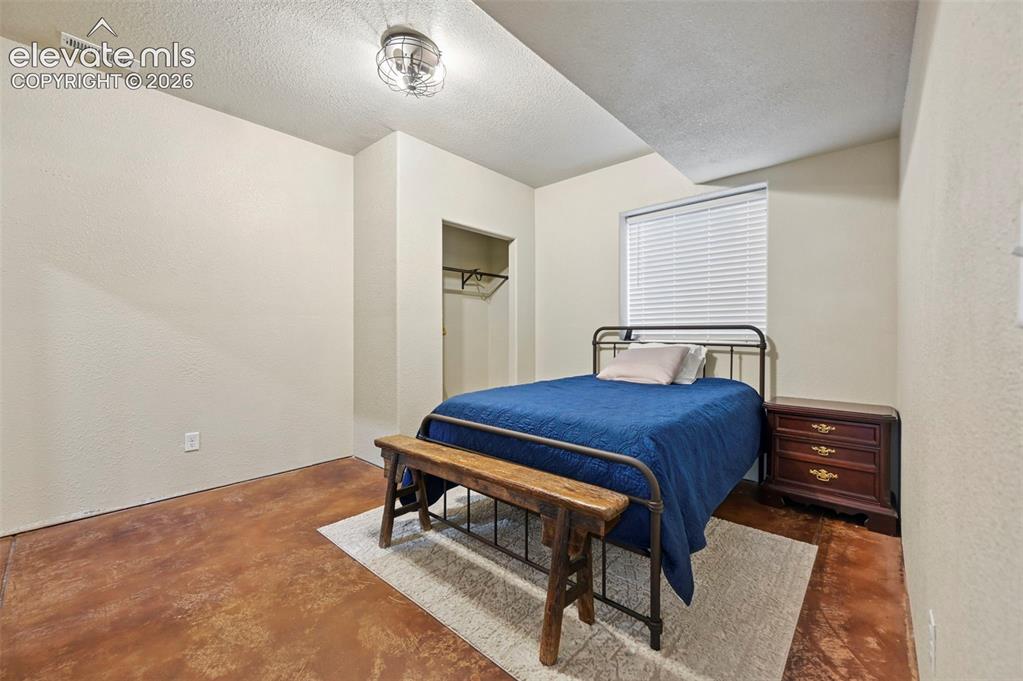 Image 30 of 39: basement bedroom