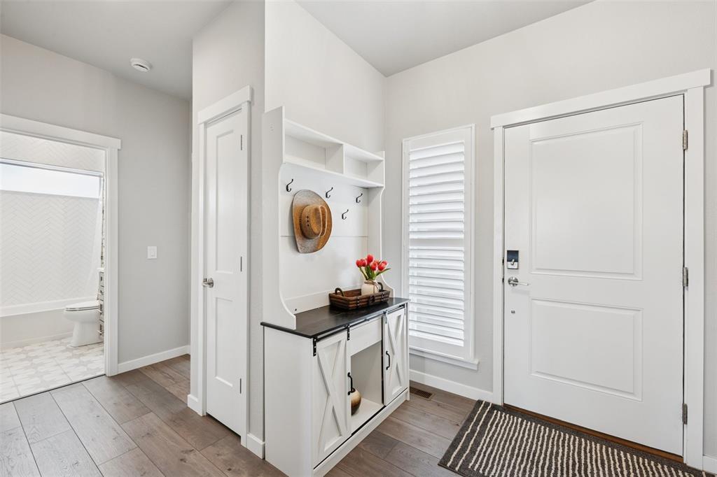 Image 13 of 44: Plantation shutters throughout and beautiful tile work!