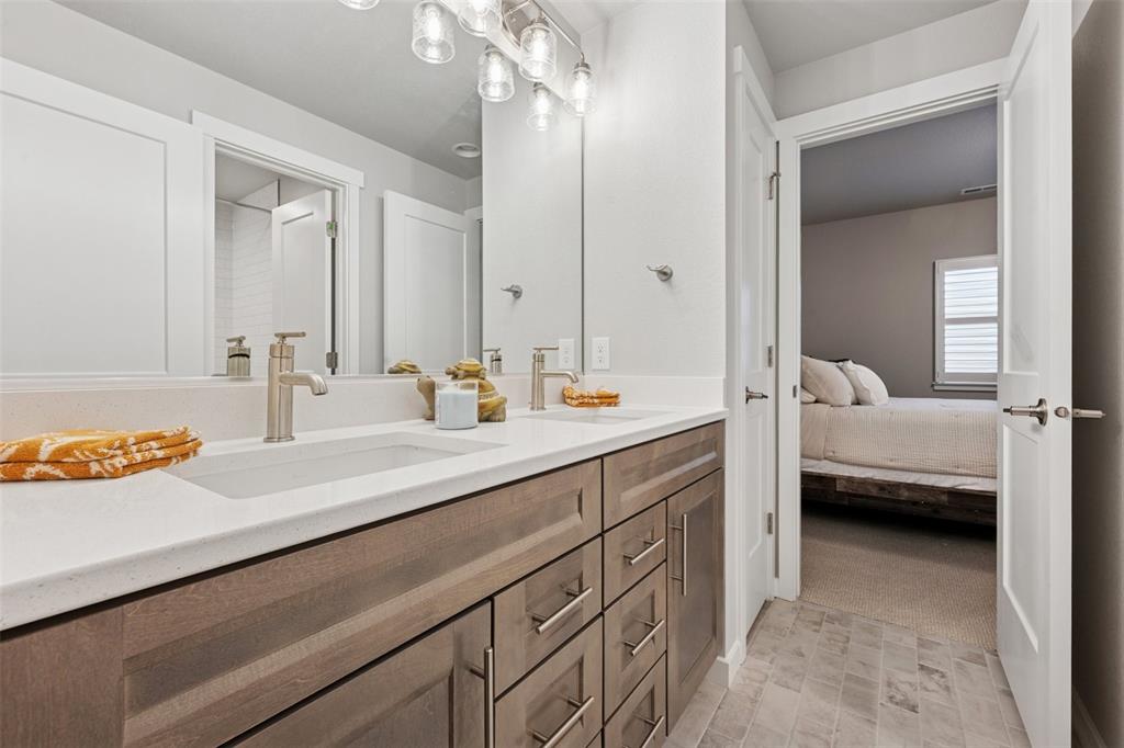 Image 37 of 44: Fourth bath is a Jack-n-Jill bath to bedroom four and five.