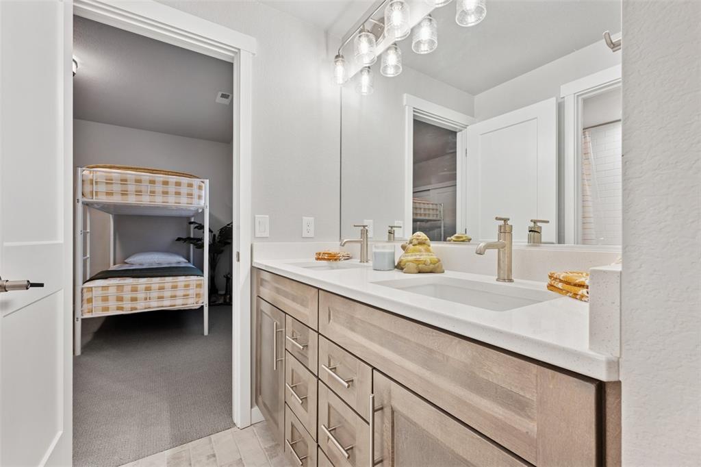 Image 38 of 44: Fourth bath jack-n-jills to bedrooms four and five!