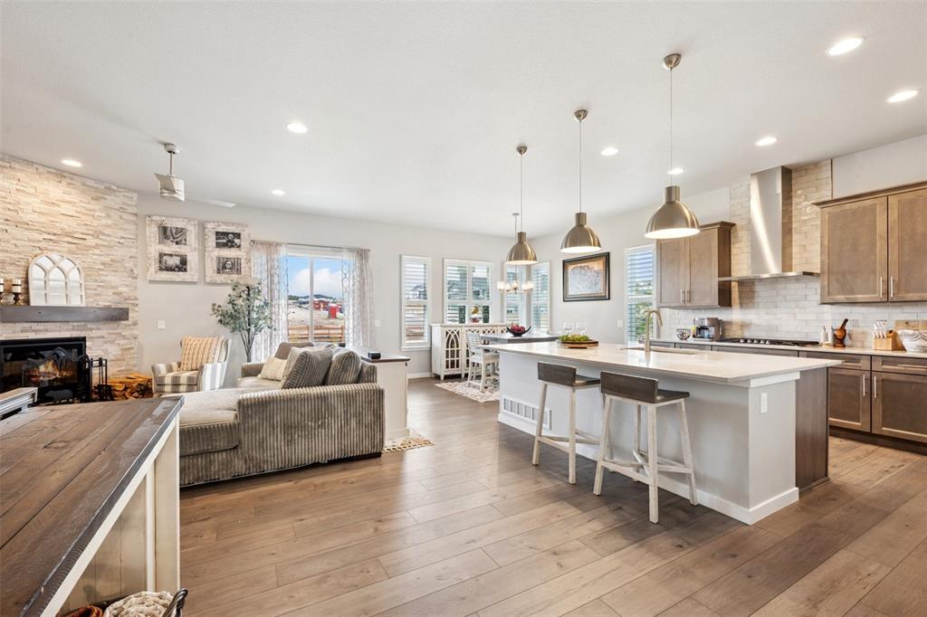 Image 7 of 44: Open floor plan and upgrades throughout! Upgraded lighting!