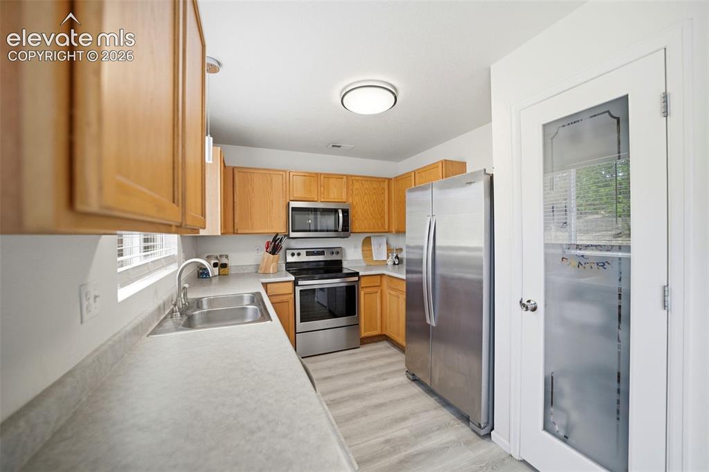 Image 11 of 38: Stainless steel appliances and pantry