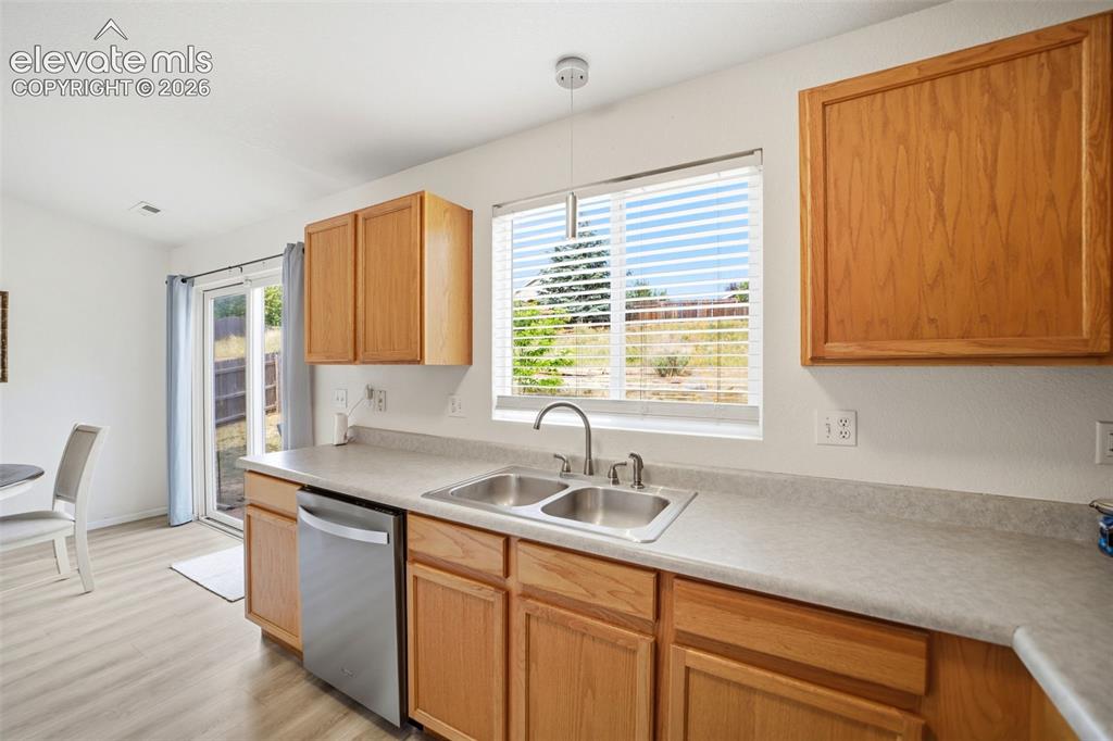 Image 13 of 38: Stainless steel appliances and pantry