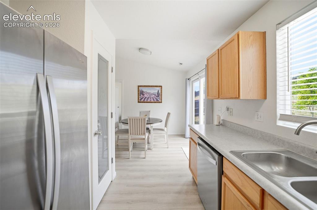 Image 14 of 38: Stainless steel appliances and pantry