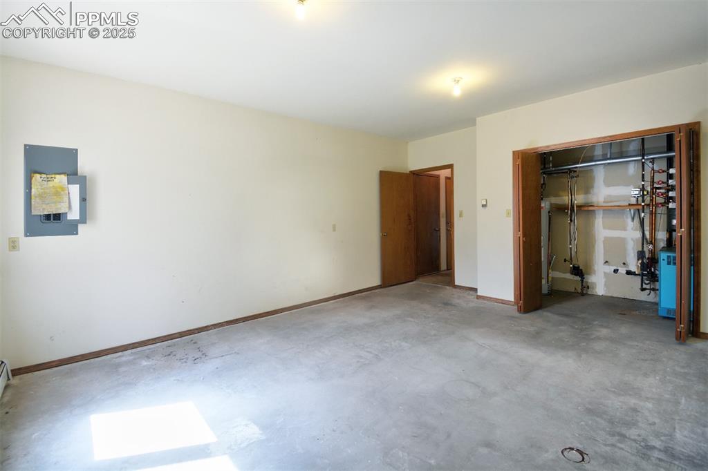 Image 15 of 46: Spacious extra lower level room with mechanical room.