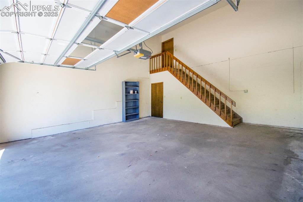 Image 42 of 46: Spacious garage with walk up to the lower level.