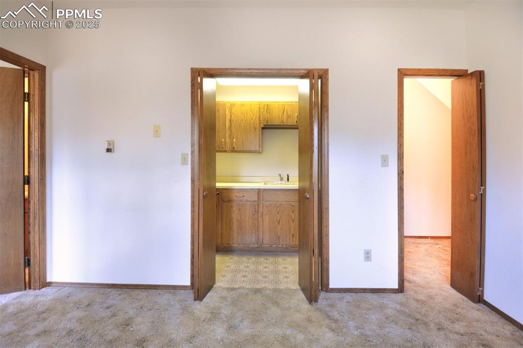 Image 7 of 46: Lower level living room with Kitchenette.