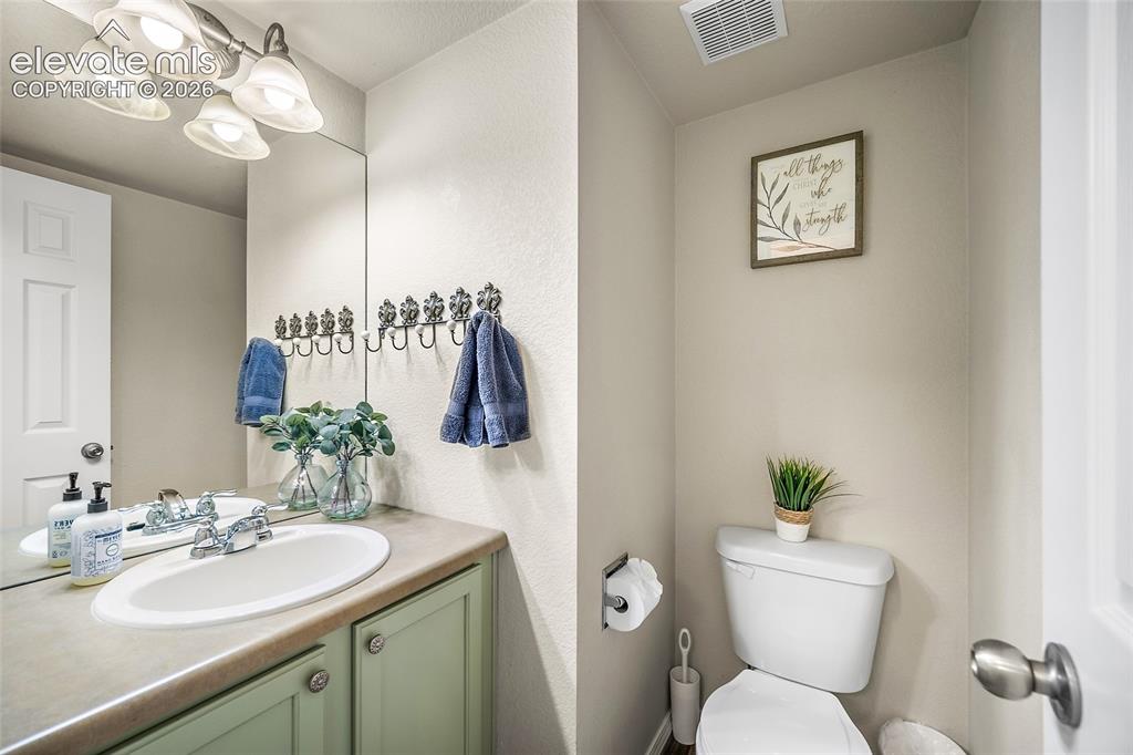 Image 23 of 42: powder room on main level