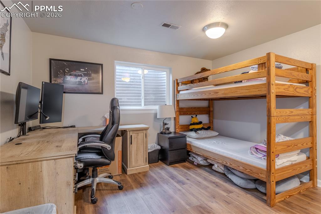 Image 27 of 29: Basement bedroom