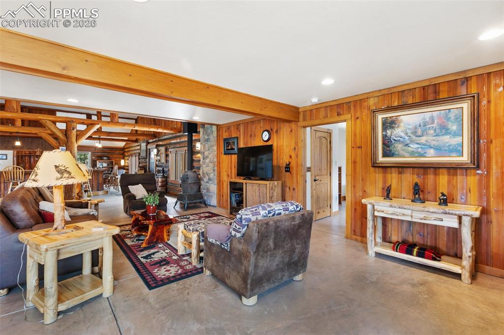 Image 12 of 48: Cozy cabin elements create an inviting atmosphere to entertain, relax, or s